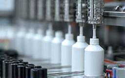 Production line for filling cosmetic bottles.